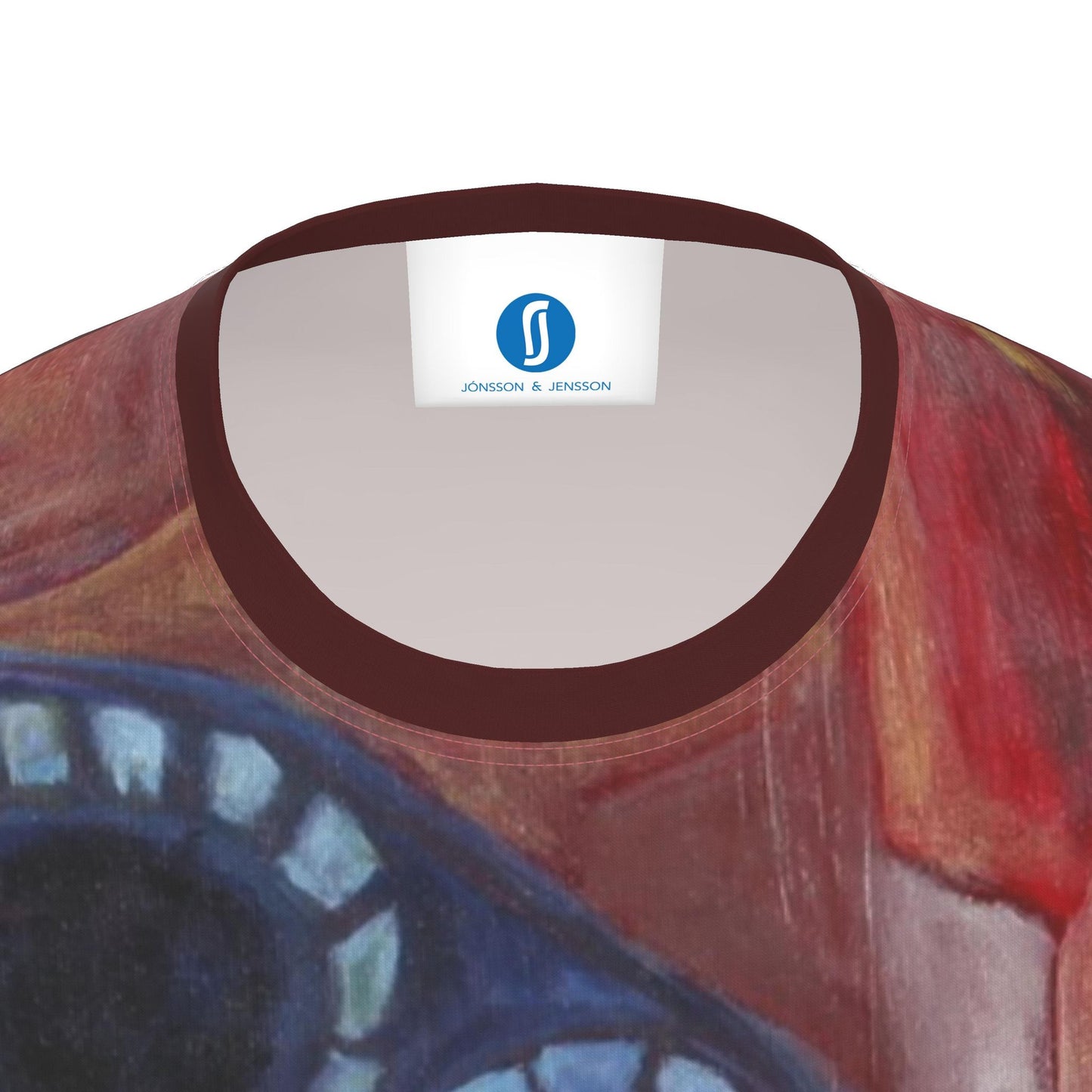 Close-up of the inside neck of a printed t-shirt with a dark brown ribbed collar and a white neck label showing the 'JONSSON & JENSSON' brand logo. The t-shirt features an abstract art print with red, brown, and blue tones.